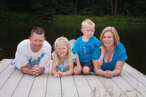 Family relaxes on dock